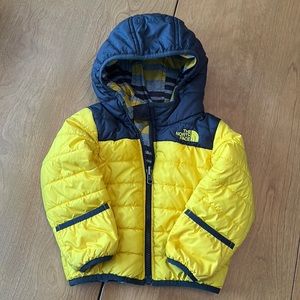 Toddler reversible North Face coat. Fold over hands. 18m size
